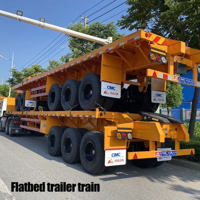 Κύρια δέσμη T700/Q345 Χάλυβα ημιπροκατασκευή CIMC HUAJUN 3 Άξονας Flatbed Trailer Train